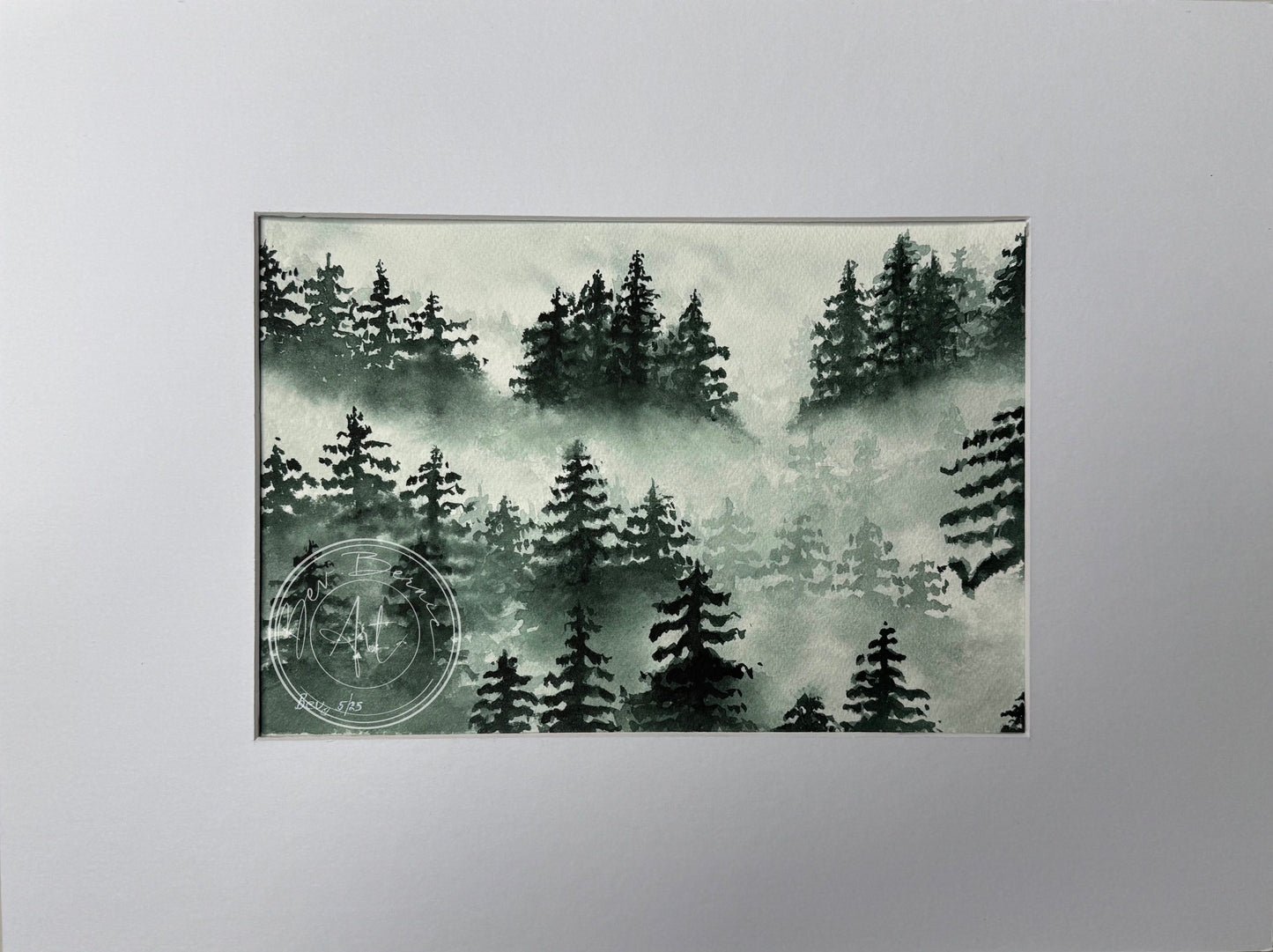 Framed artwork of a forest scene with trees and mist on a light gray background