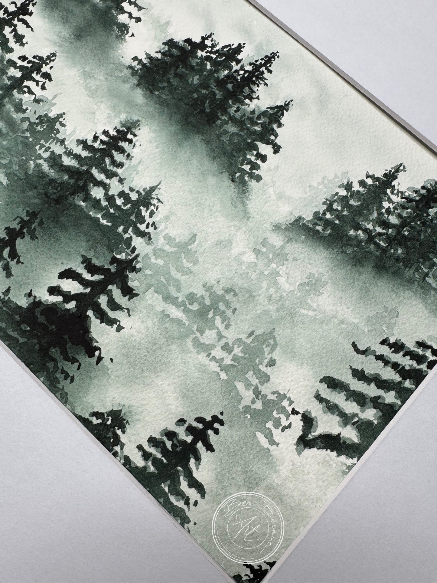 Artistic depiction of trees on a textured surface with a brand logo in the corner.