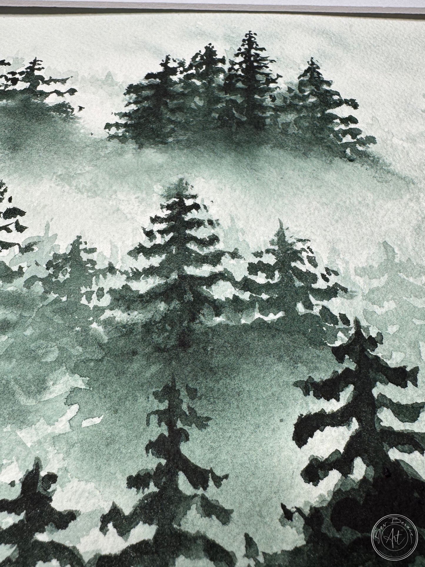 Watercolor painting of evergreen trees on a misty background