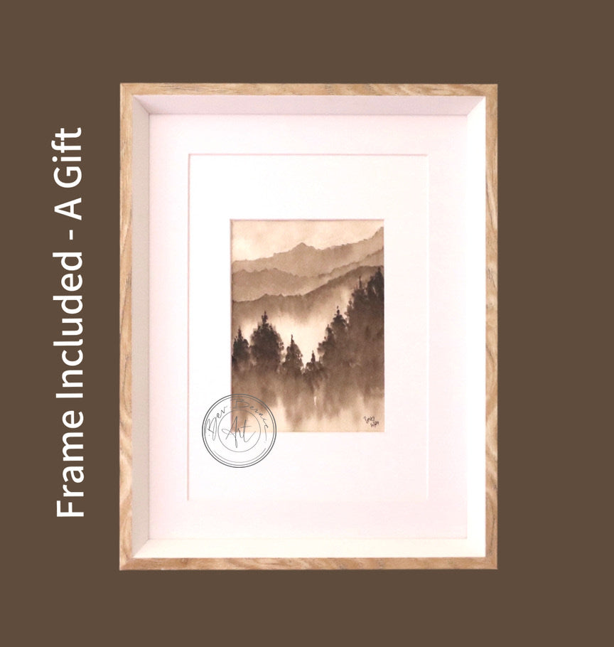 Monochromatic watercolour painting of a misty mountain landscape with a dense forest in the foreground, framed in a light wood frame with a white mat.