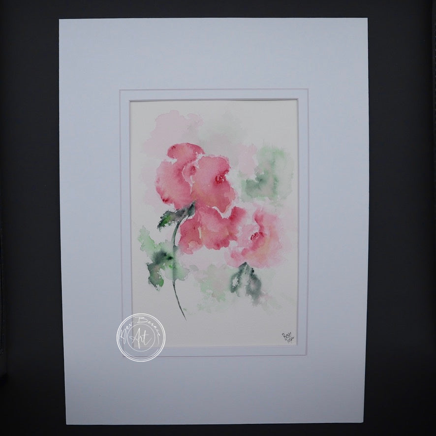 Main view of Rosy Grace, featuring soft pink roses painted in watercolour with delicate green leaves, mounted in a white mat.