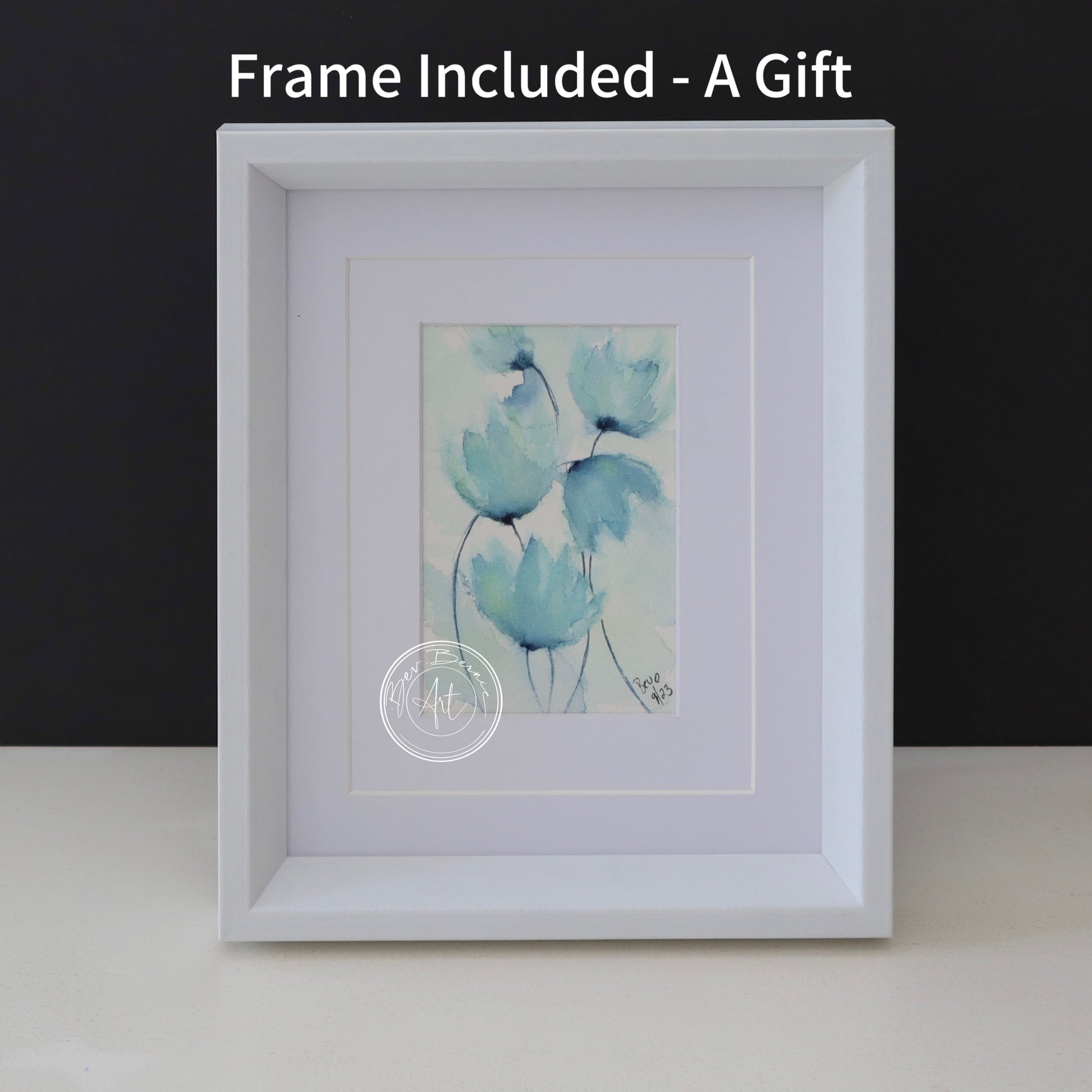 Watercolour painting of stylised, translucent blue flowers with hints of green on a textured, off-white background, framed in a white frame with a white mat.