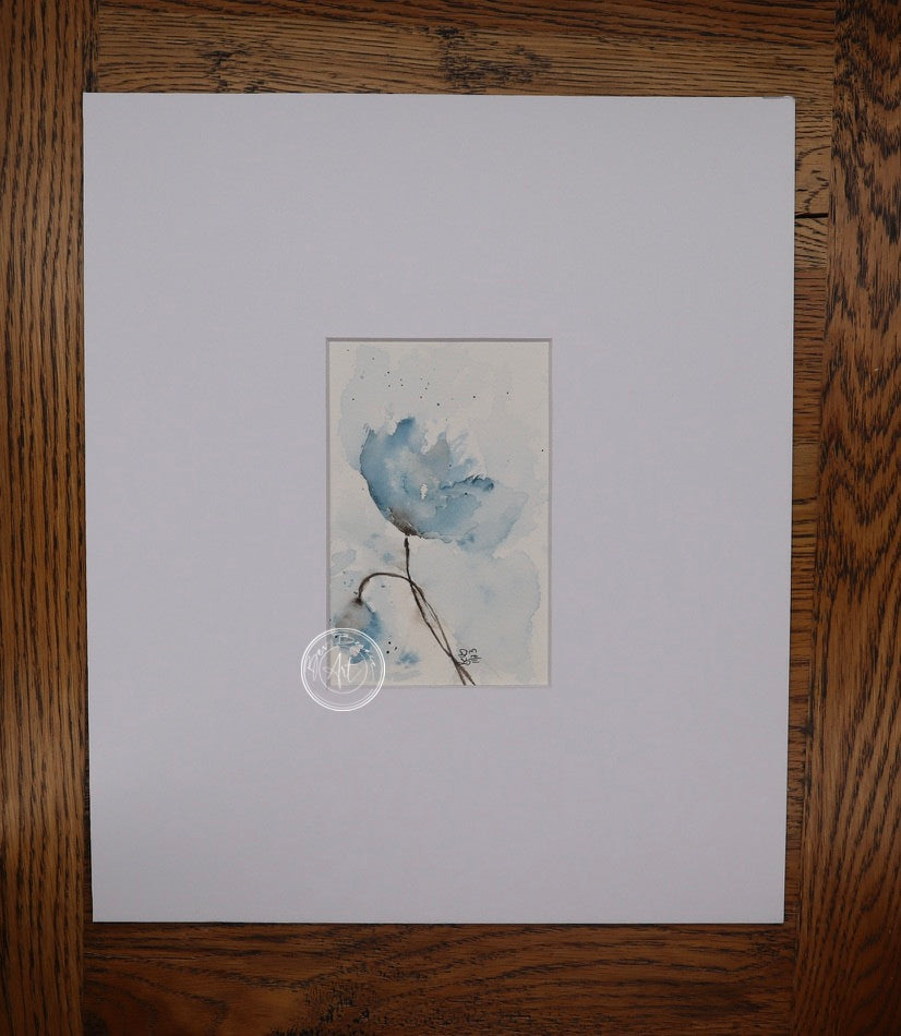 Watercolour painting of a blue flower with a thin stem, set against a pale blue background.
