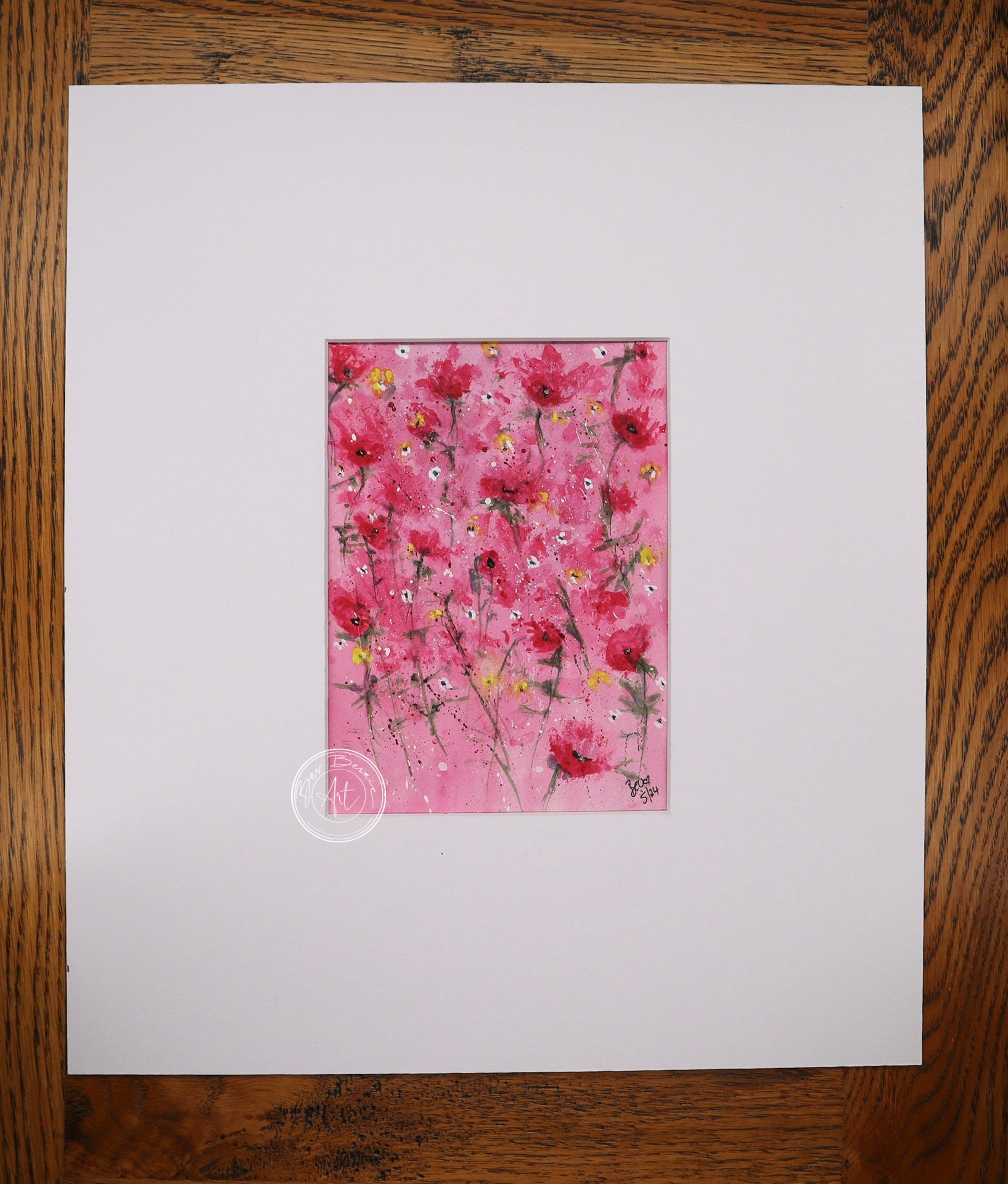 Watercolour painting of red poppies with yellow centres scattered across a bright pink background.