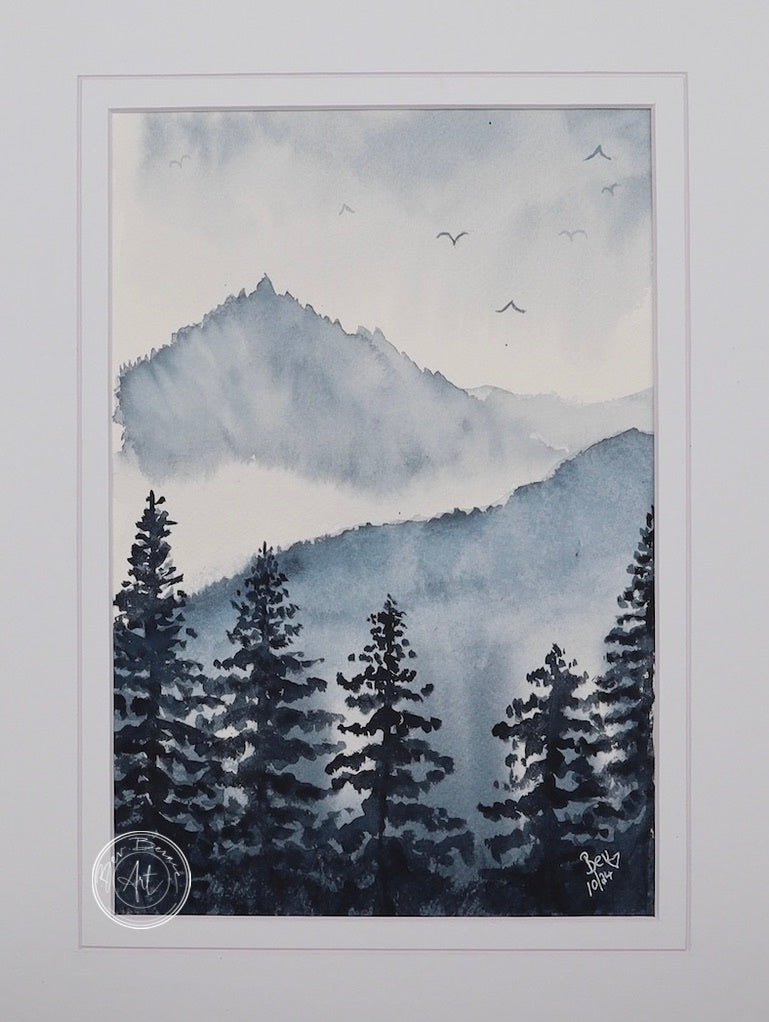 Watercolour painting of a misty mountain landscape with dark evergreen trees in the foreground and hazy blue mountains in the background.