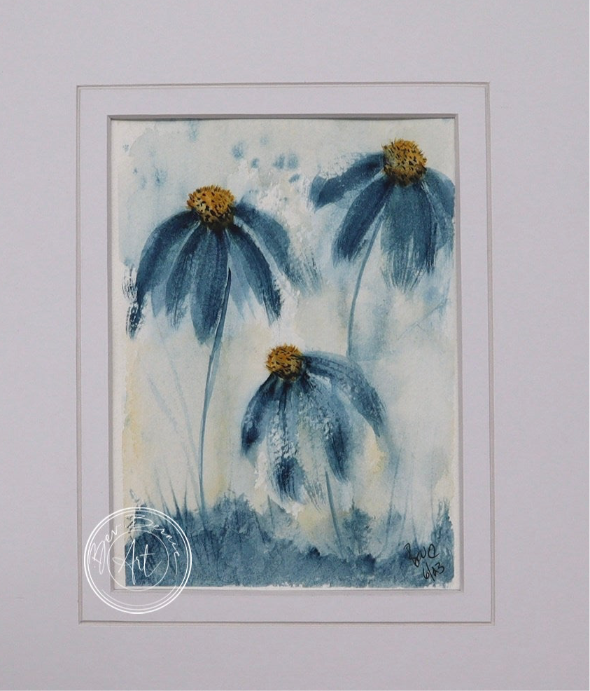 Painting of three blue daisy-like flowers with yellow centres and long stems, rising from a patch of blue-green grass against a light blue and white background.