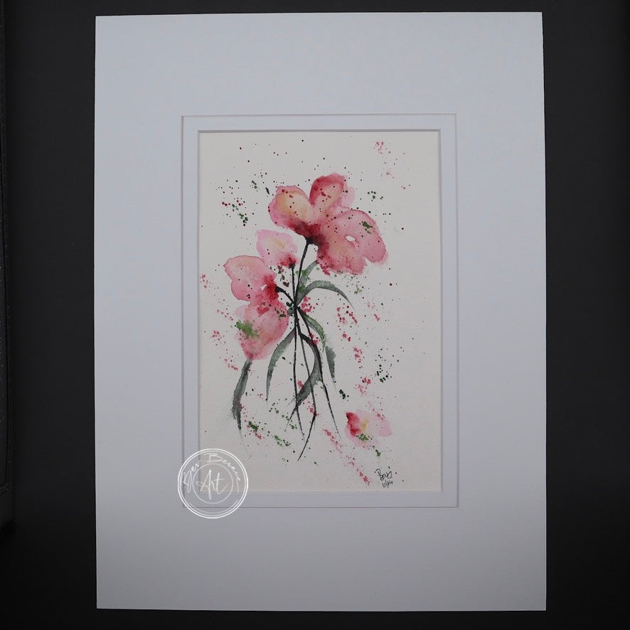Watercolour painting of three pink flowers with long, thin stems and splatters of pink and green paint on a white background.