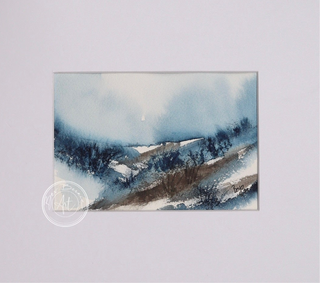 Watercolour painting of a misty landscape with rolling hills, blue skies, and a hazy horizon.