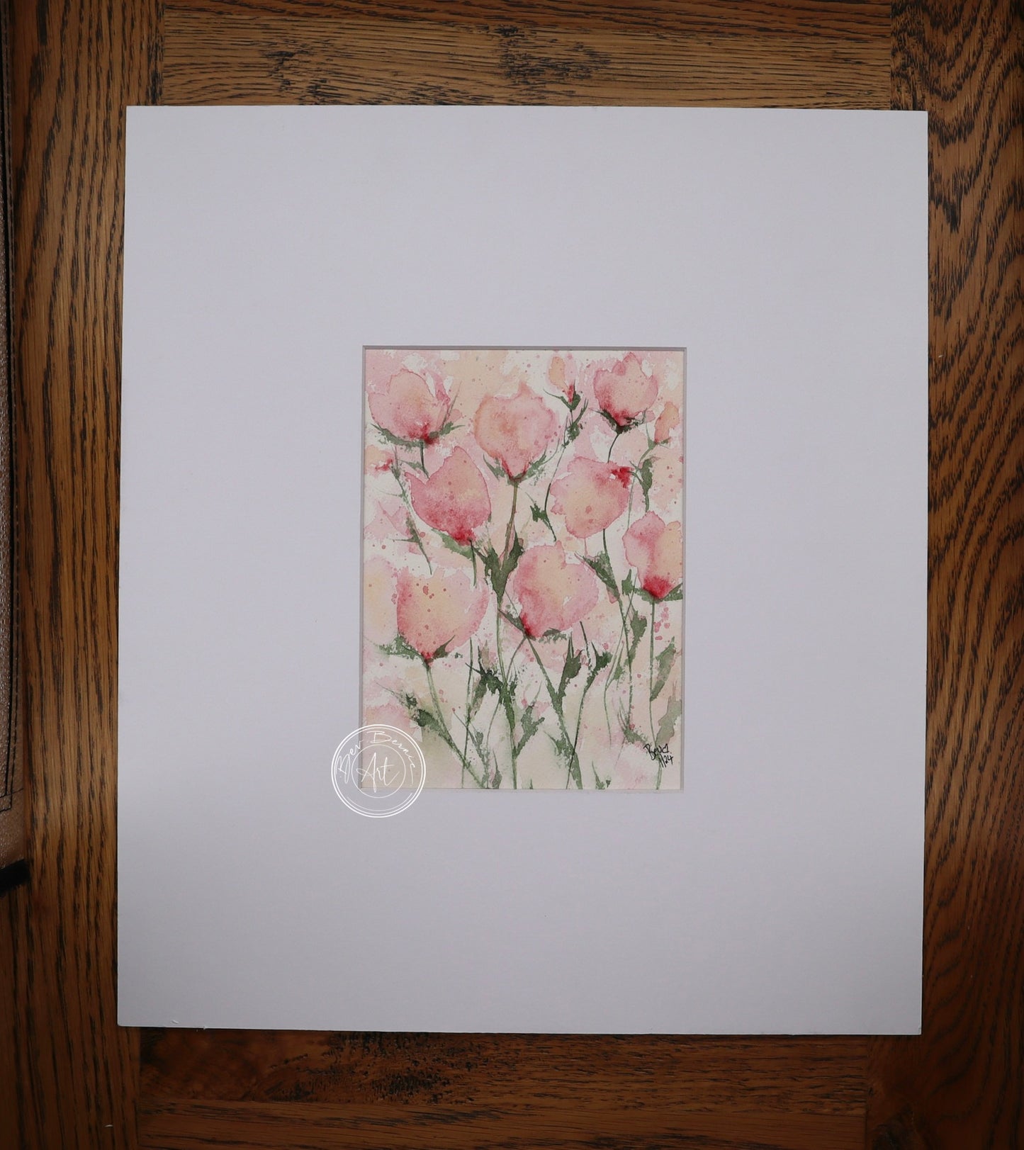 Watercolour painting of several pink flowers with delicate green stems against a pale pink and white