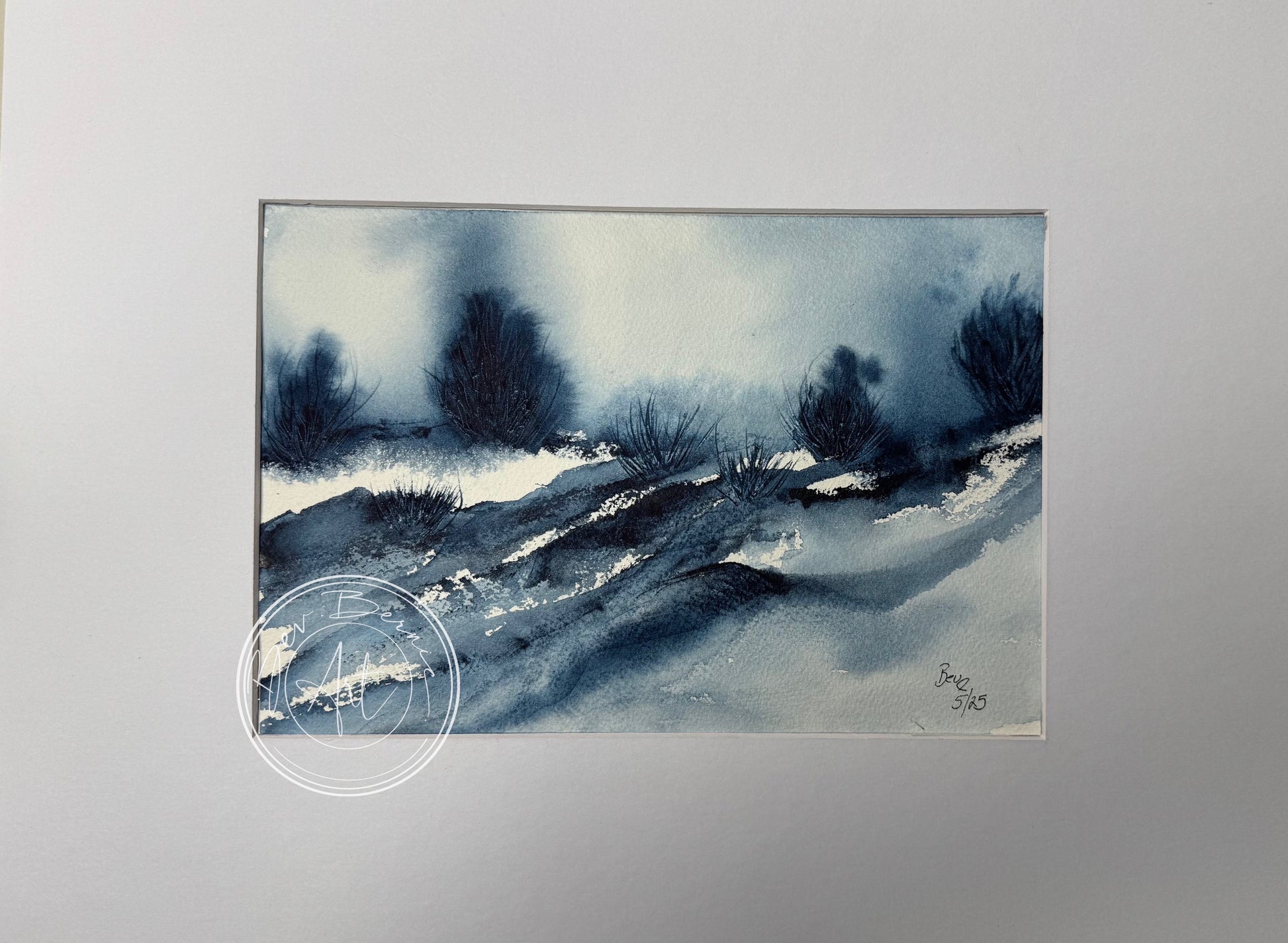 Image of a blue landscape with bushes 