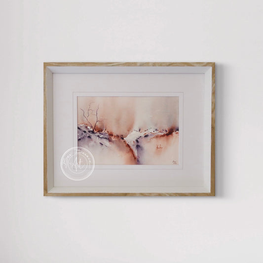 Framed abstract artwork on a white wall