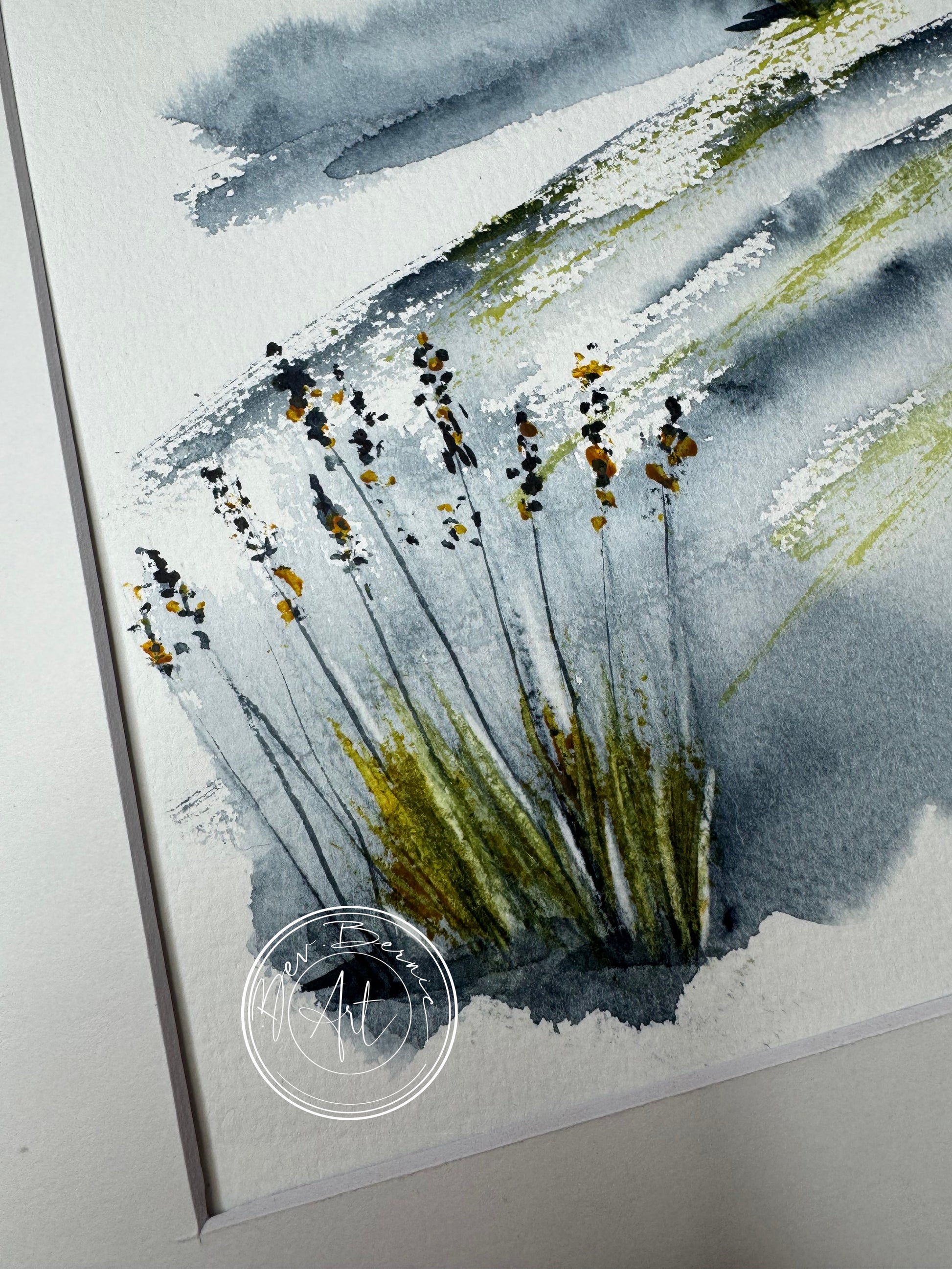 Watercolor painting of grass and sky with a signature in the corner