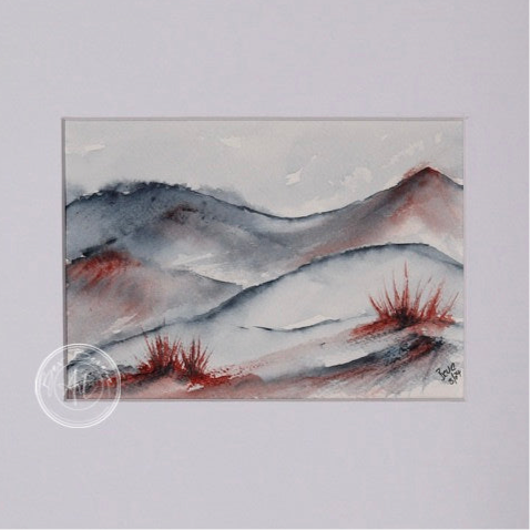 Watercolour painting of a rolling landscape with blue-grey hills and splashes of red, possibly representing desert shrubs, in the foreground.